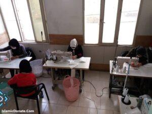 Women sewing masks, empowering local economies. Donate with crypto like BTC.