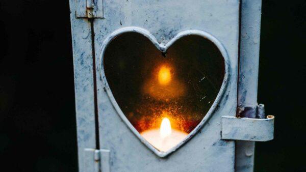 Heart-shaped donation lantern with a lit candle, symbolizing quick crypto donations via Litecoin.