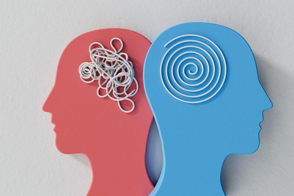 Two profiles representing mental states: one red with a tangled mess of white lines, the other blue with a neat spiral, symbolizing the journey from distress to peace in holistic well-being, with support from crypto donations like Bitcoin.