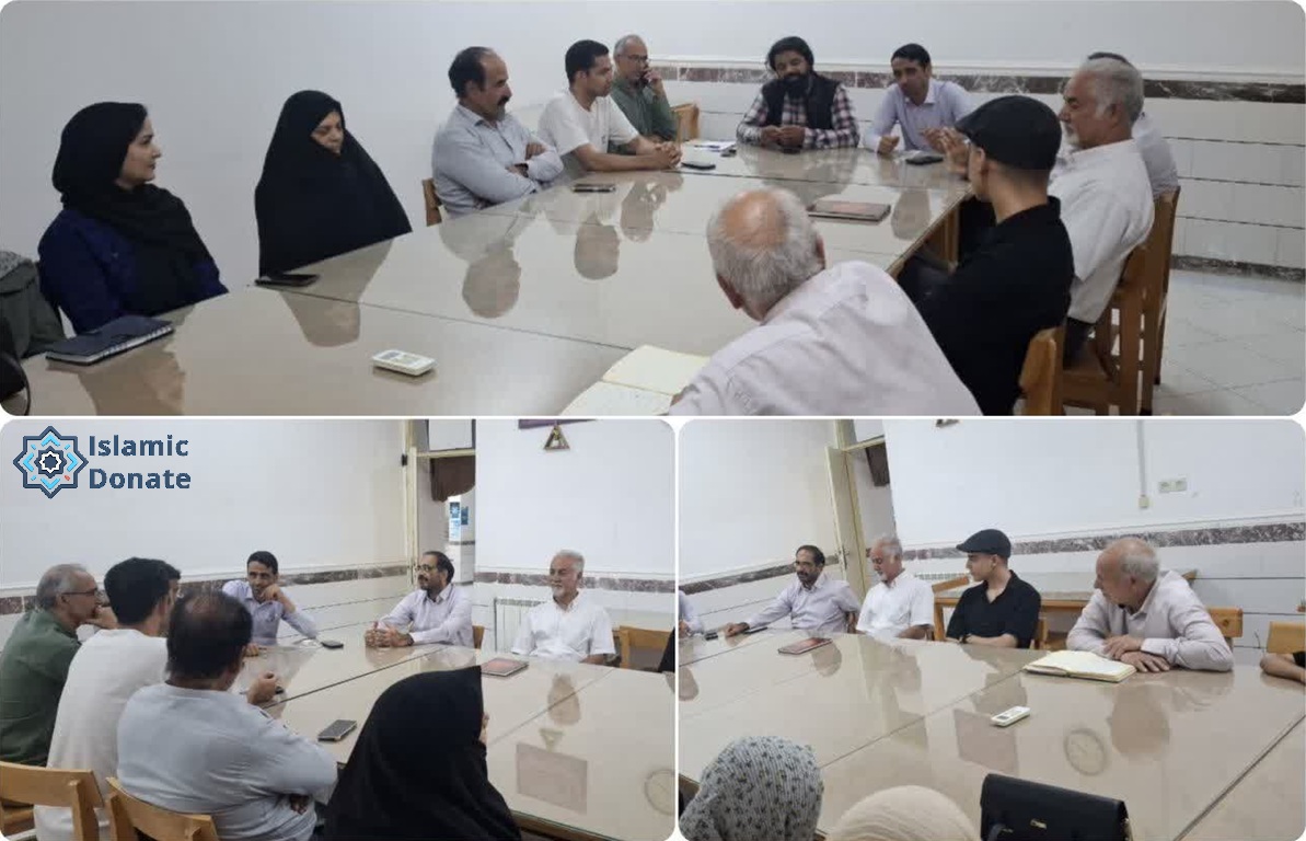 A group of people, including men and women, sit around a table discussing projects. Local trustees offer expertise to define, execute, monitor, and inspect crypto charitable projects.